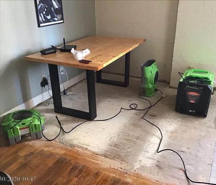 dining room floor removed with SERVPRO's equipment drying the area