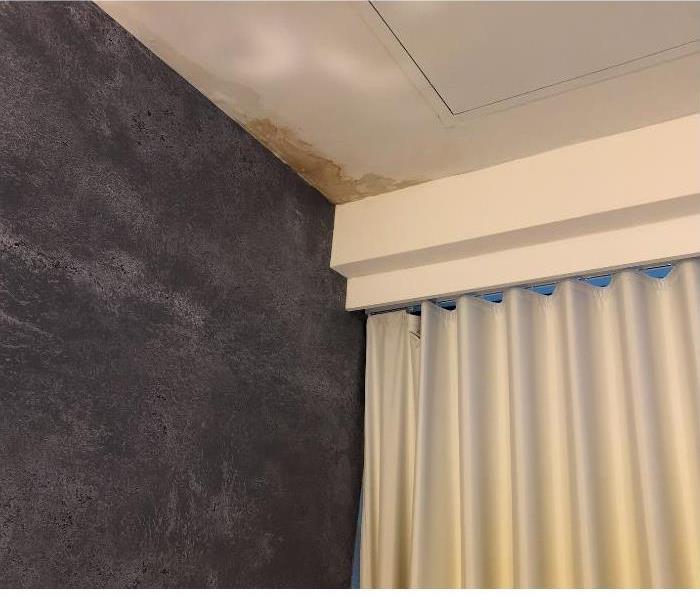 water damage in corner of ceiling 