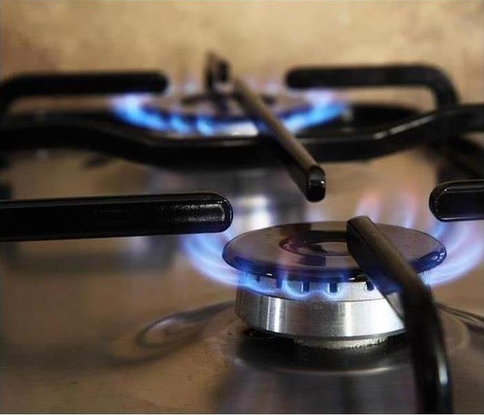 gas stove with flame present 