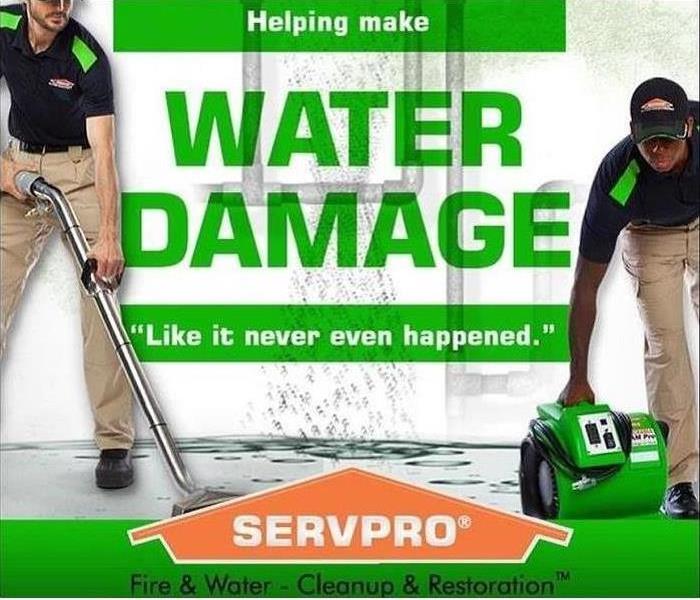 2 SERVPRO employees cleaning, with the text "helping make water damage "Like it never even happened."
