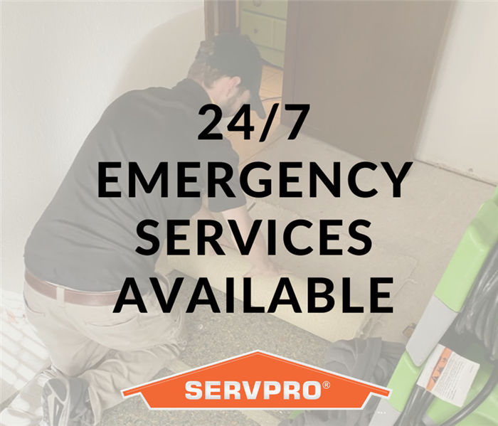 Male SERVPRO employee on job site removing flooring with typography "24/7 services available"